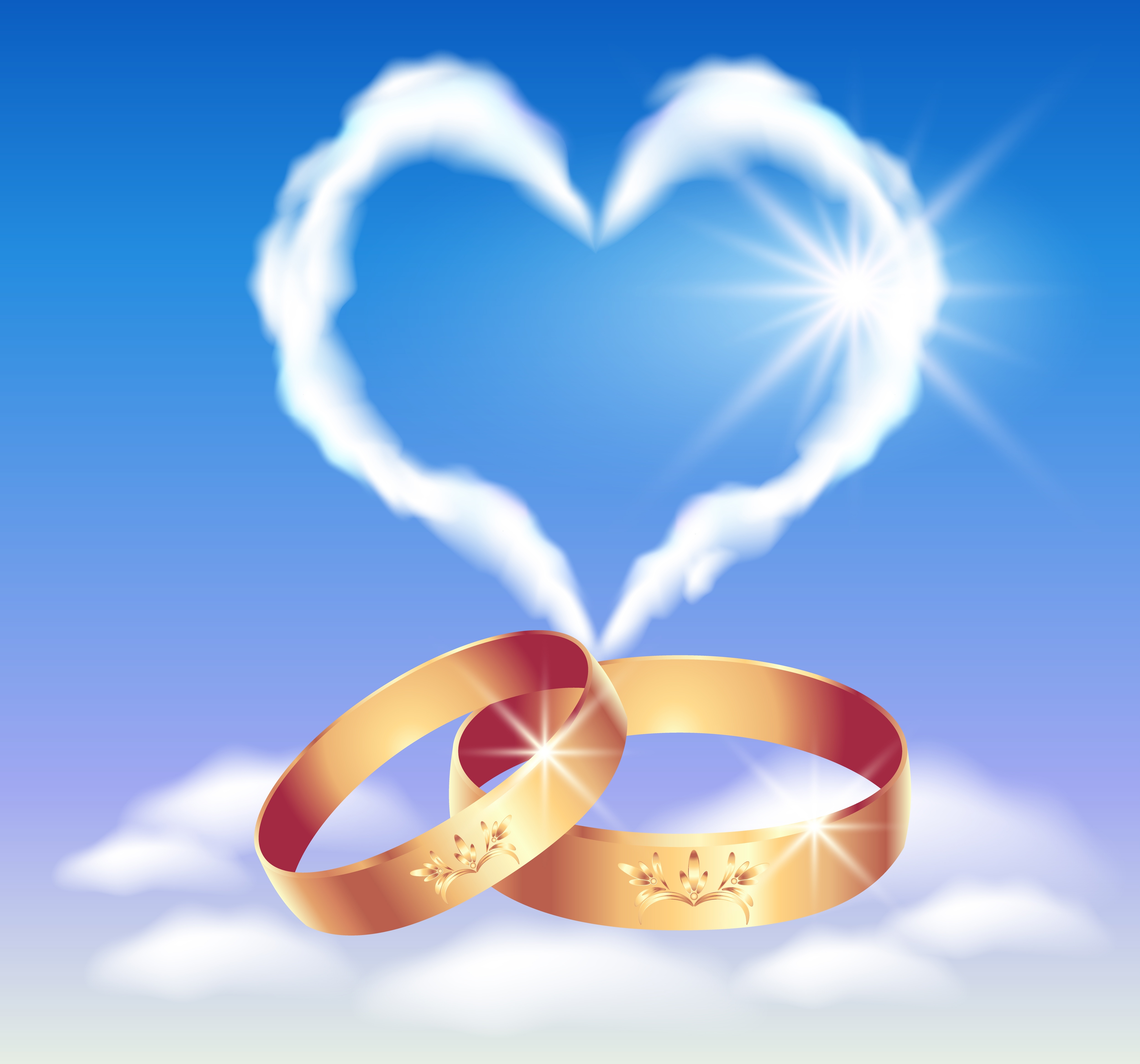 12168715 - card with wedding rings and heart in the clouds